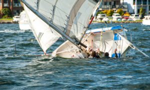 capsized racing sailboat